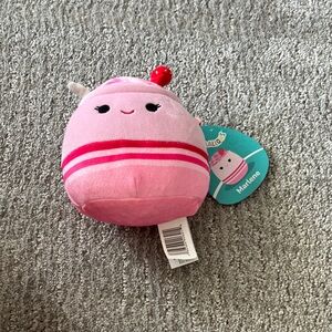 Squishmallows Pink and Red Stuffed Animal that is sented